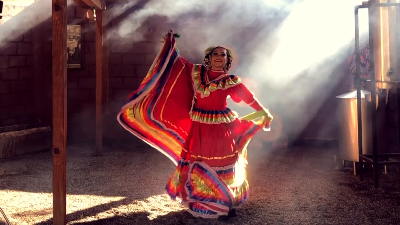China Poblana dancer spinning her skirt in beams of sunlight at a tequila distillery in Sayulita, Nayarit
